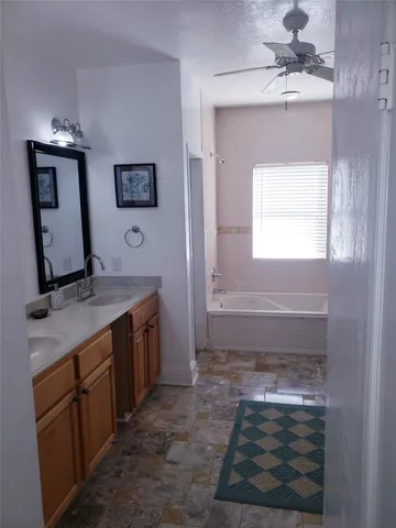 a white bath tub sitting next to a window