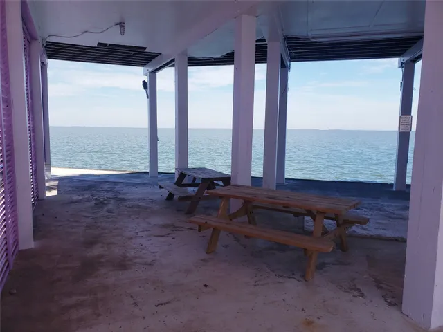 a view of a room with lounge chair and a large window