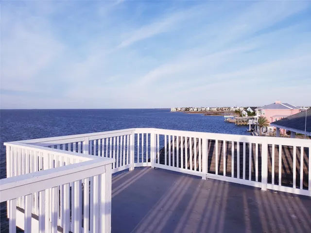 a view of balcony with wooden floor