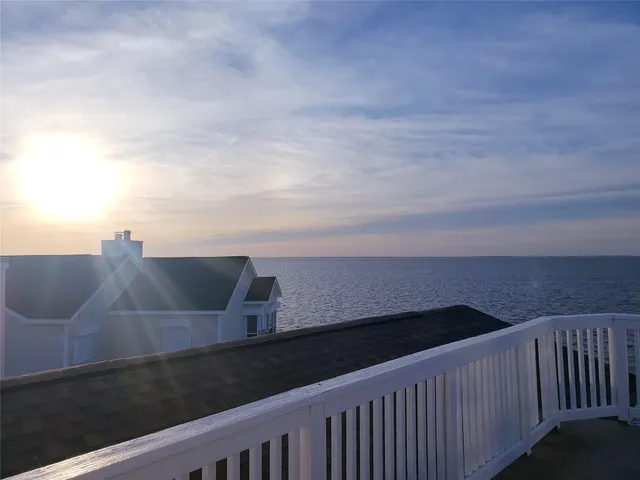 a view of a porch with a table and chair
