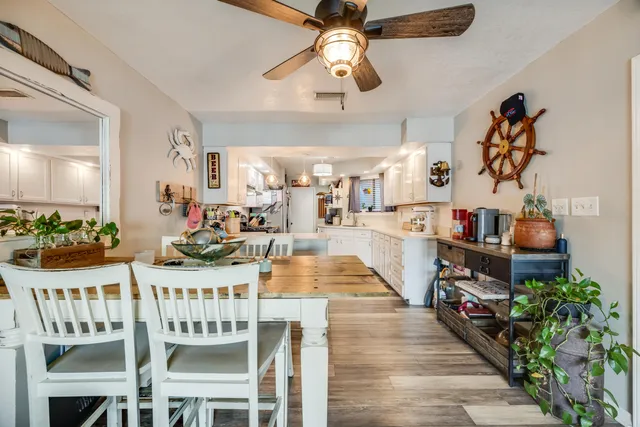 a kitchen with stainless steel appliances a stove a sink cabinets and a refrigerator