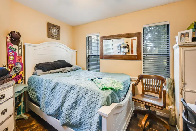 a view of a balcony with lake view and large windows