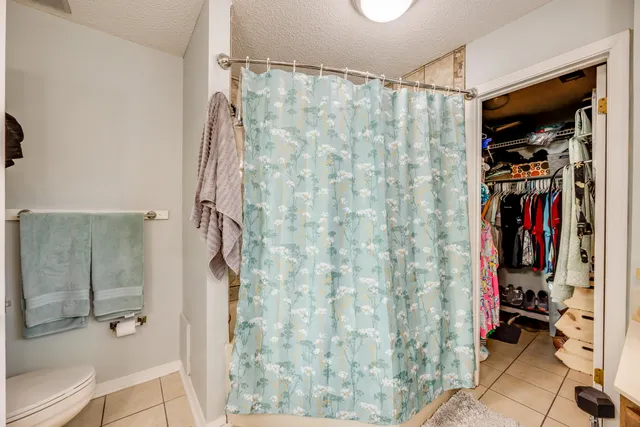 an aerial view of a house with garden space and lake view