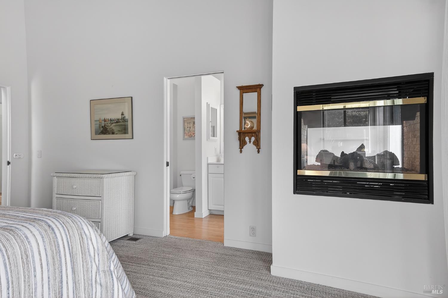 41339 Westwind The Sea Ranch, CA 95497 - Photo 28 of 60 Two sided glass fireplace in primary bedroom
