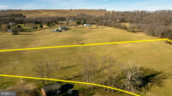 a view of swimming pool with an outdoor seating
