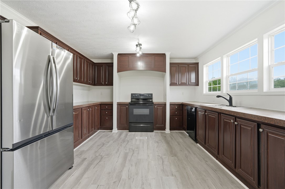 112 Sir Francis Drake Way Liberty, SC 29657 - Photo 30 of 42 This spacious kitchen offers ample cabinetry and natural light, perfect for culinary endeavors.