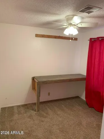 a room with a projector and furniture