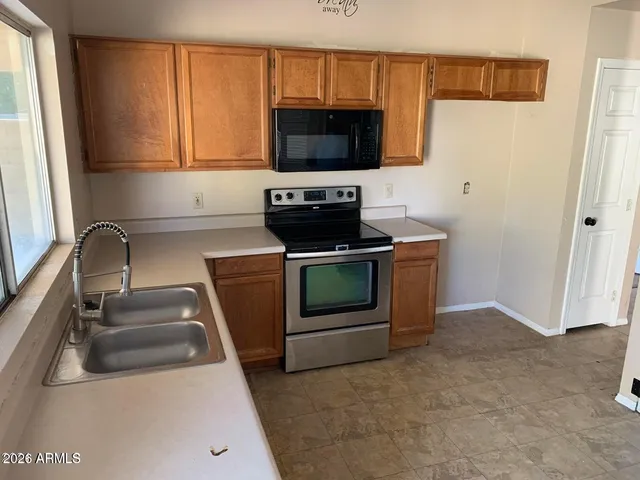 a kitchen with a stove and a sink