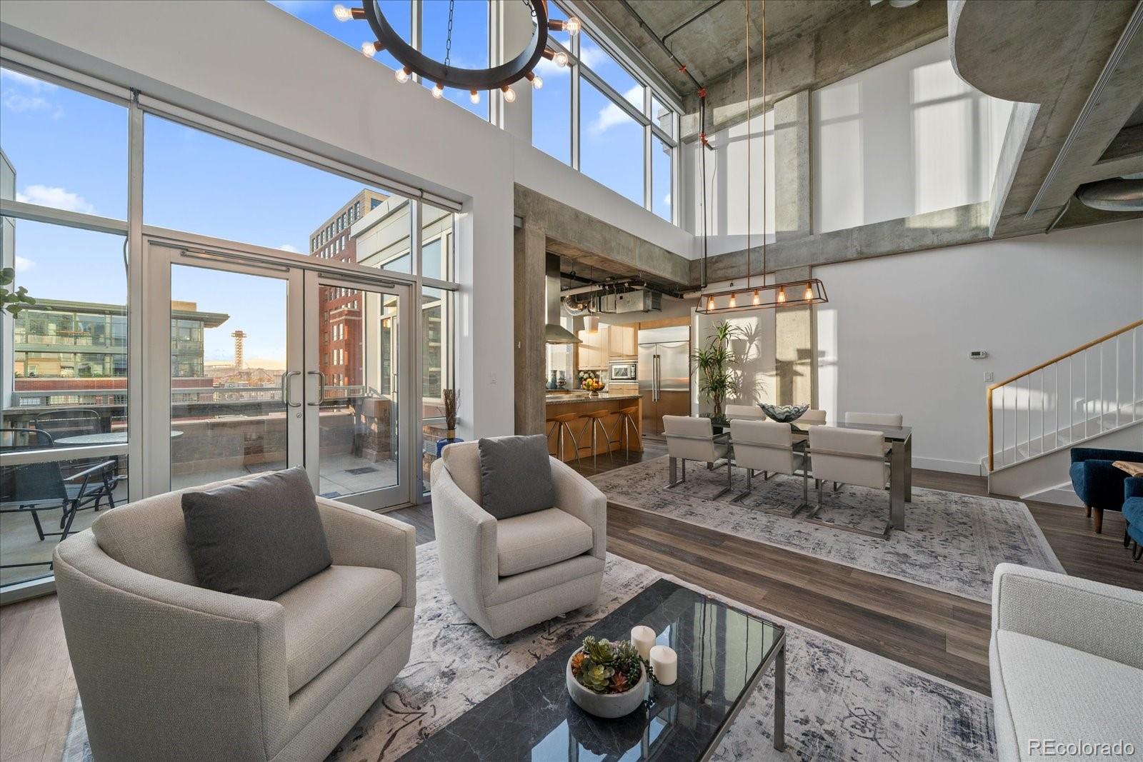 1610 Little Raven Street, Unit PH5 Denver, CO 80202 - Photo 12 of 44 a lobby with furniture and floor to ceiling window