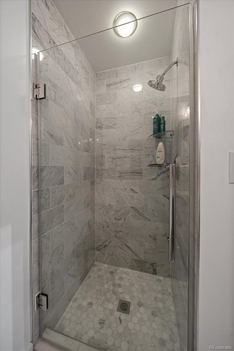 1610 Little Raven Street, Unit PH5 Denver, CO 80202 - Photo 26 of 44 a bathroom with a shower