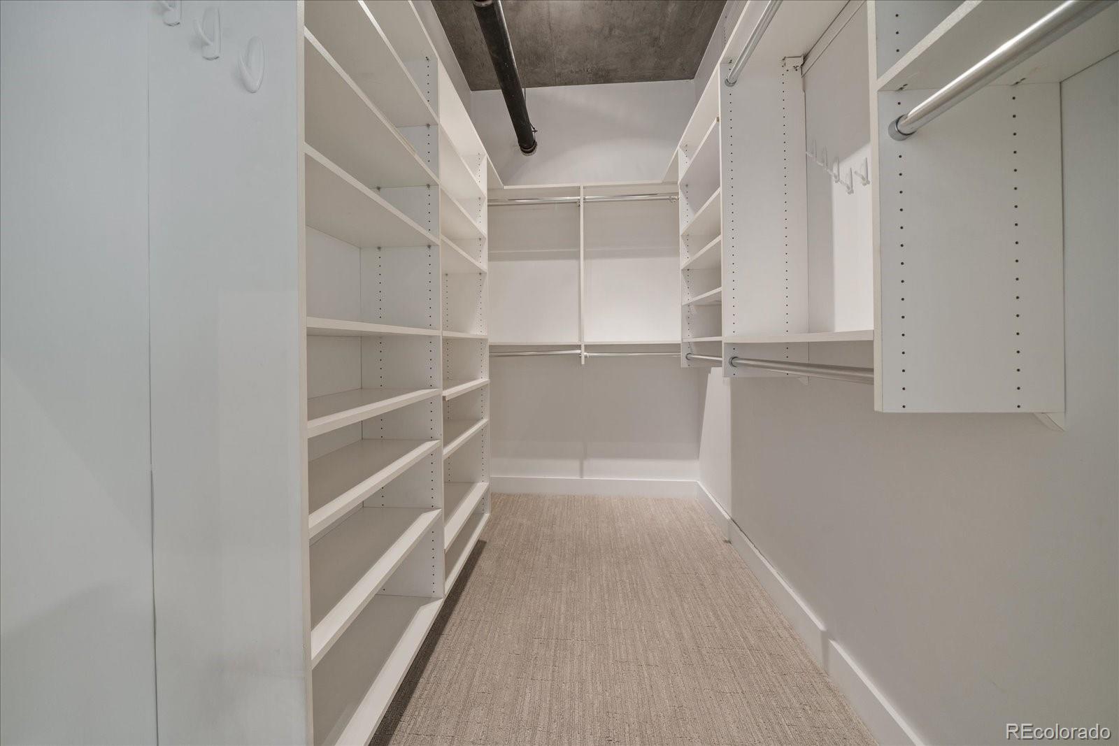 1610 Little Raven Street, Unit PH5 Denver, CO 80202 - Photo 33 of 44 a view of walk in closet with empty racks