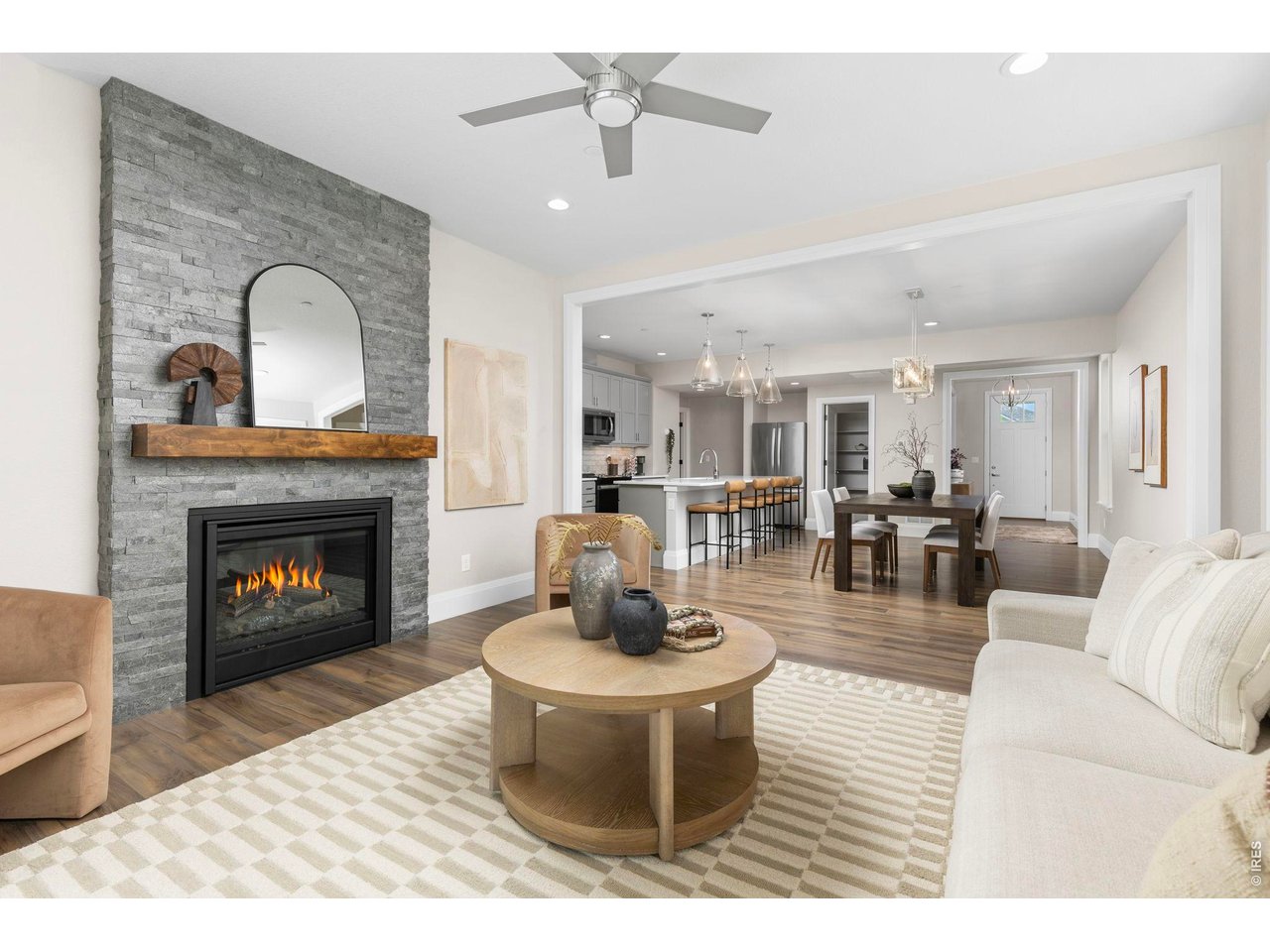 5700 West 2nd Street Road Greeley, CO 80634 - Photo 15 of 40 A cozy double-sided gas fireplace brings character and atmosphere to the home