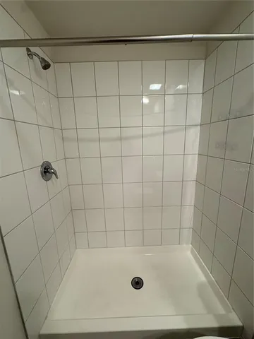 a bathroom with a shower and a bathtub