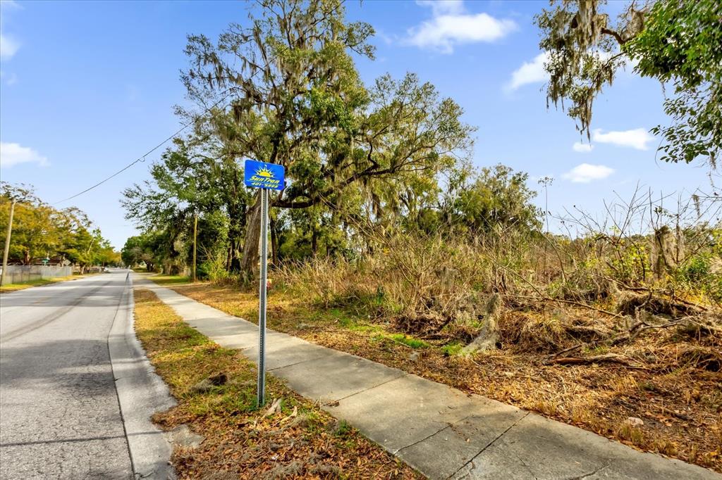 1650 Northwest 7th Street Ocala, FL 34475 - Photo 42 of 43 a street view with tall trees