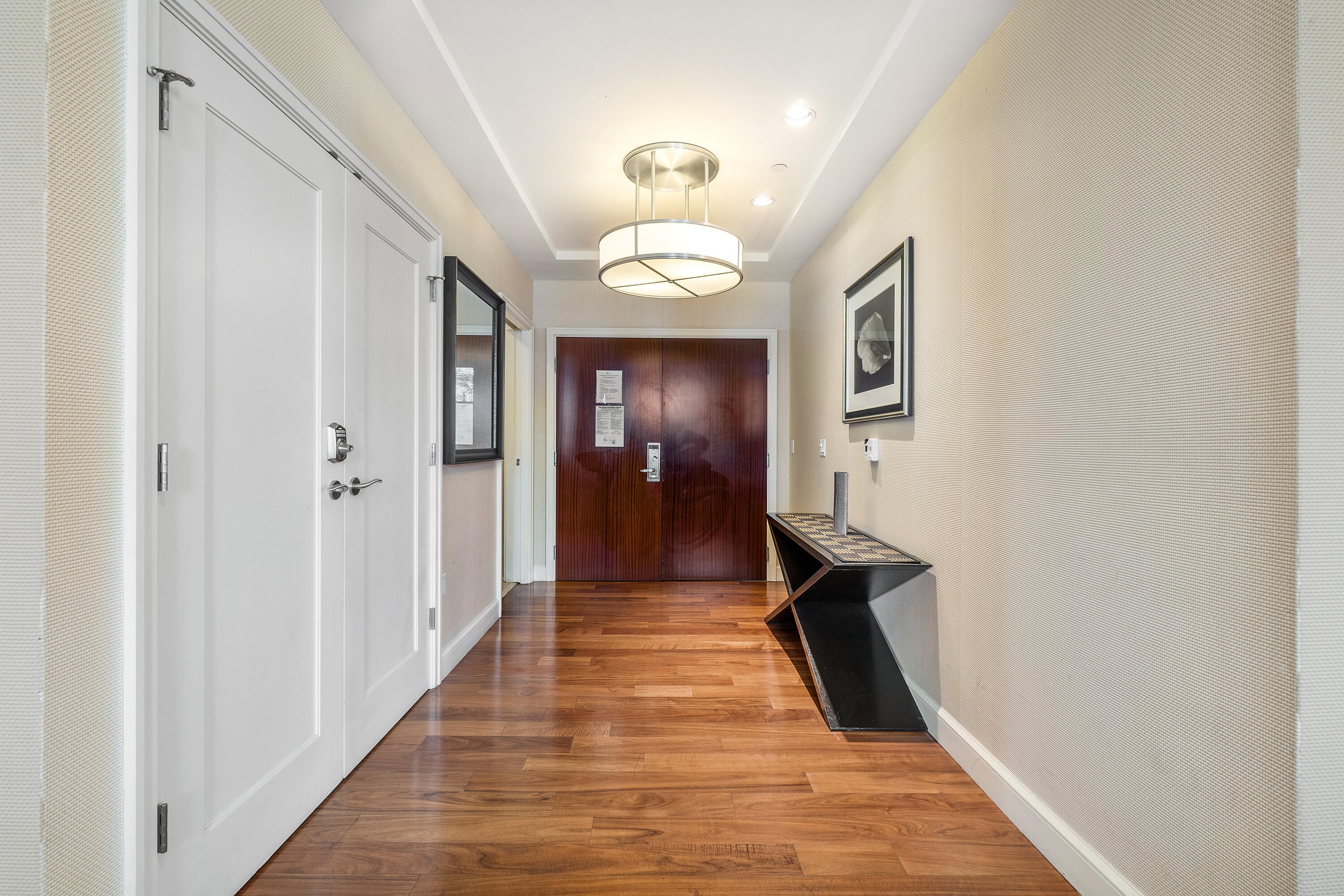3800 North Ocean Drive Riviera Beach, FL 33404 - Photo 26 of 51 a view of a hallway with wooden floor and staircase
