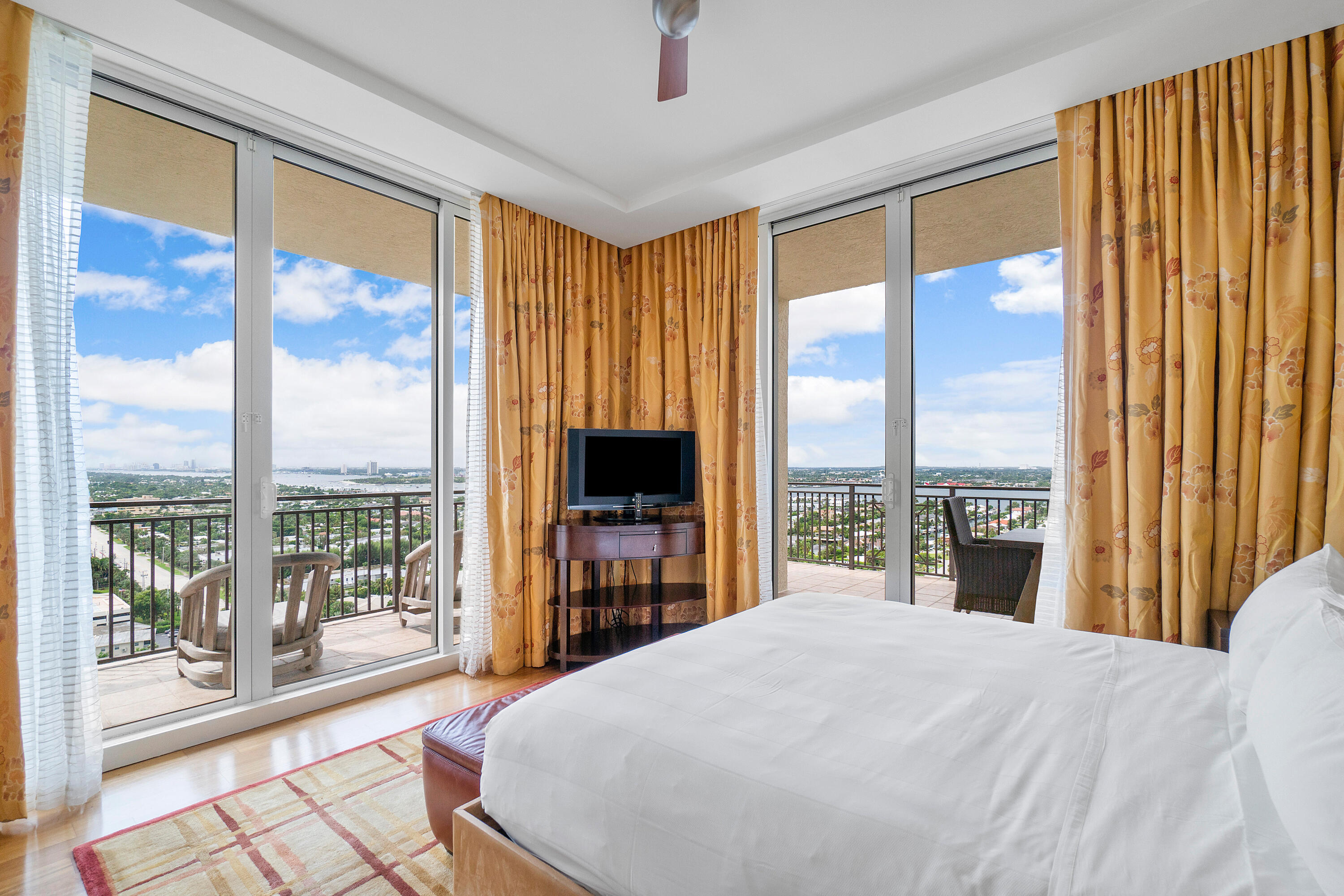 3800 North Ocean Drive Riviera Beach, FL 33404 - Photo 28 of 51 a bedroom with a large window and a bed
