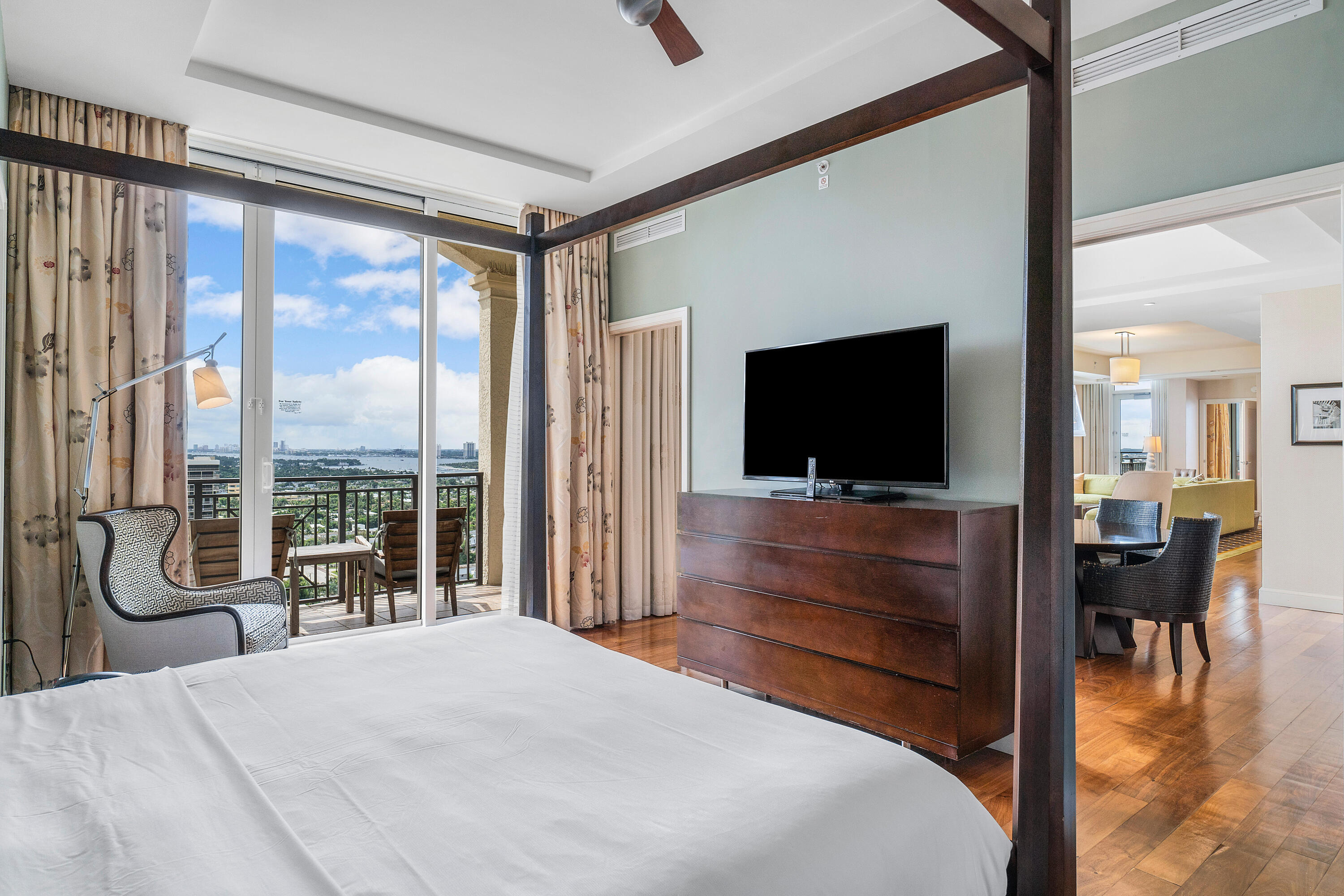 3800 North Ocean Drive Riviera Beach, FL 33404 - Photo 35 of 51 a bedroom with a bed and a flat screen tv