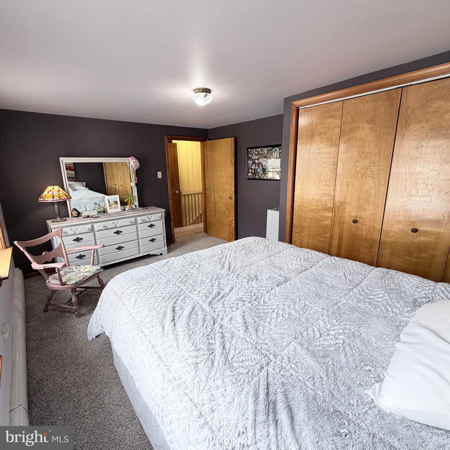 12997 Main Street Fort Loudon, PA 17224 - Photo 36 of 48 a bedroom with a bed and large flat tv screen