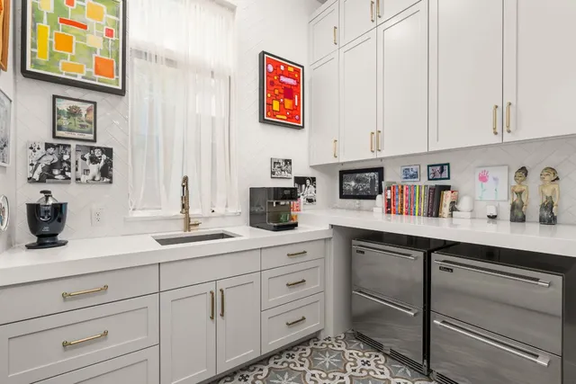 a bedroom with a bed furniture and a large window