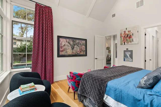 a spacious bathroom with a double vanity sink mirror and bathtub