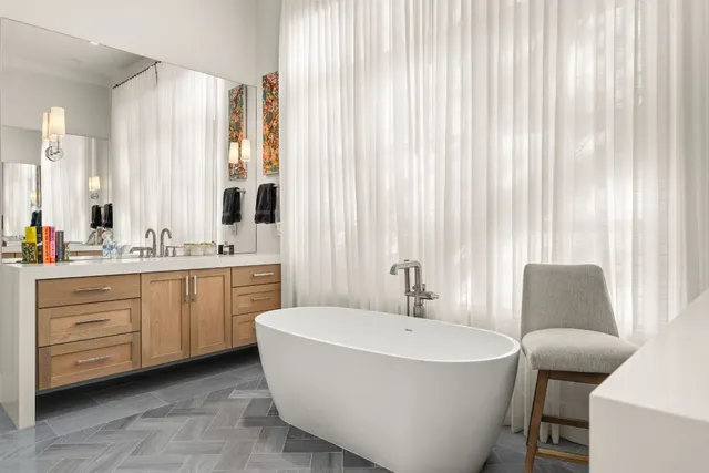 a bedroom with furniture and a window