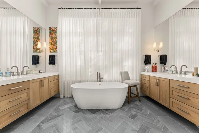 a bathroom with a sink double vanity and a mirror