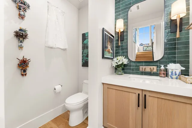 a bathroom with a toilet sink and shower