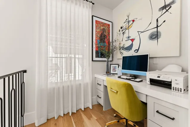 a bedroom with a bed and a table