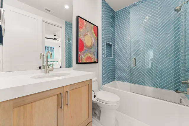 a bathroom with a sink a mirror and shower