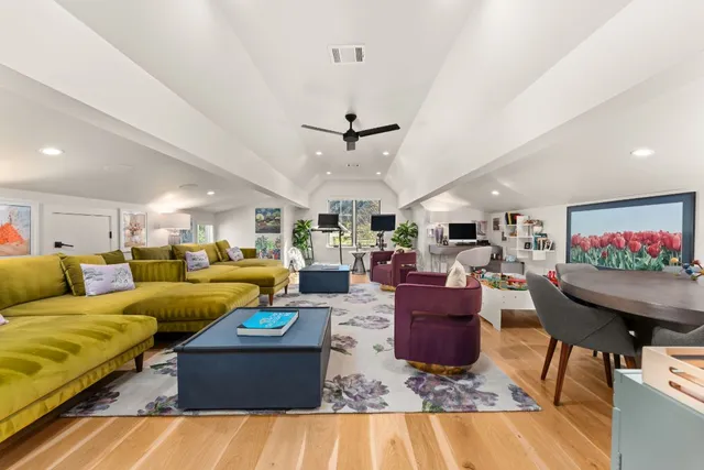 a balcony view with a seating space