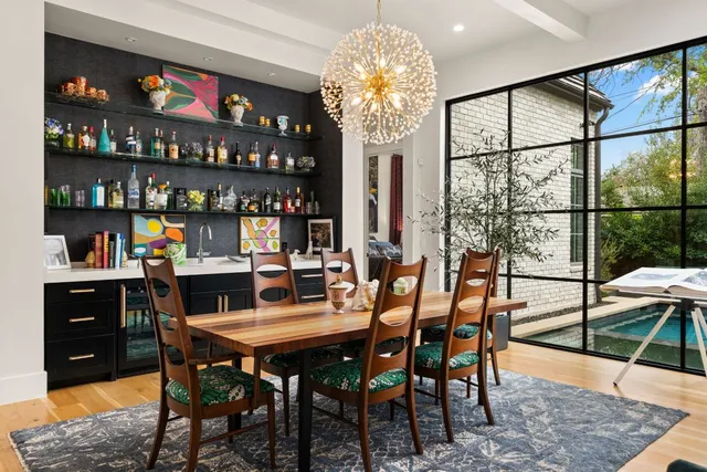 a dining room with furniture and chandelier