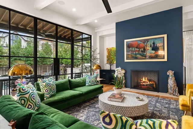 a living room with furniture a rug and a fireplace