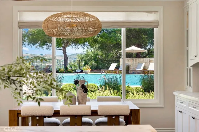 a view of swimming pool with seating space