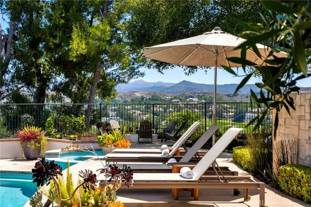 a kitchen with sink cabinets and stove top oven