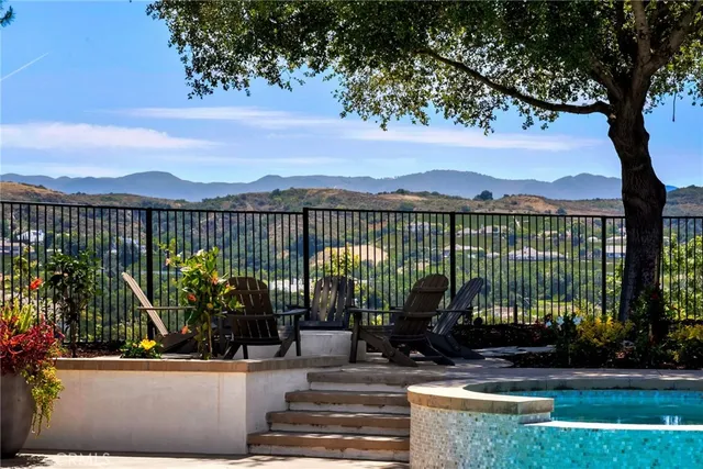 a view of a patio with a table and chairs