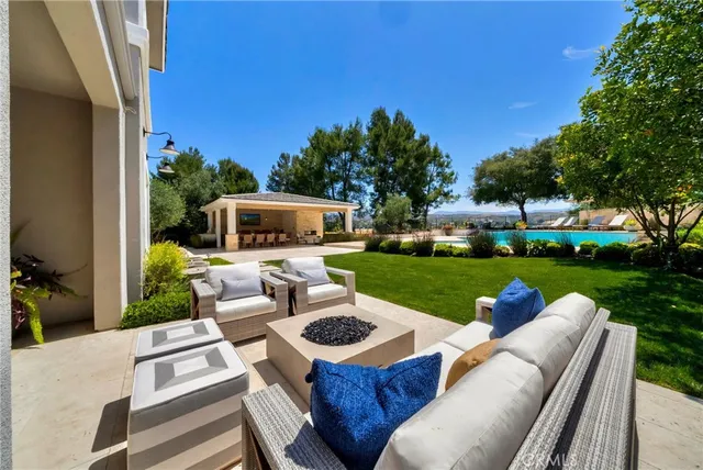 a view of a swimming pool with a patio