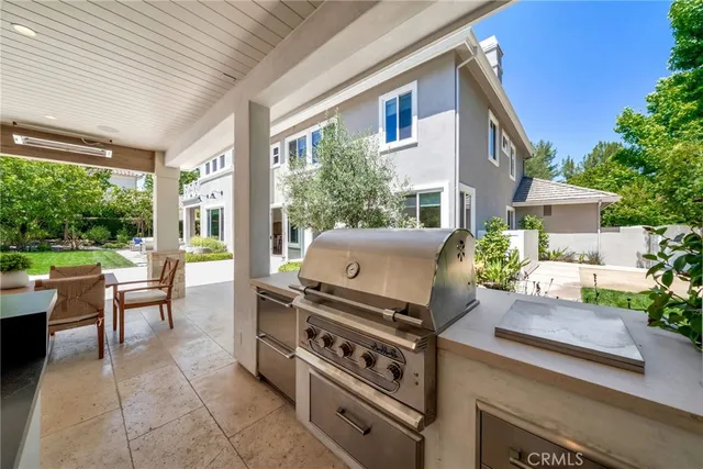 a bedroom with a bed and a large mirror