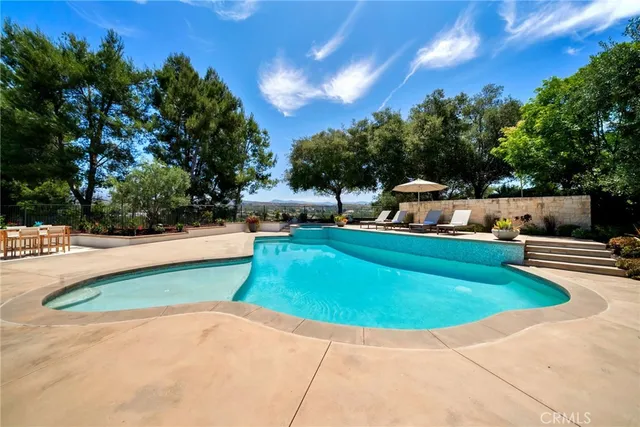 a large room with wooden floor and windows