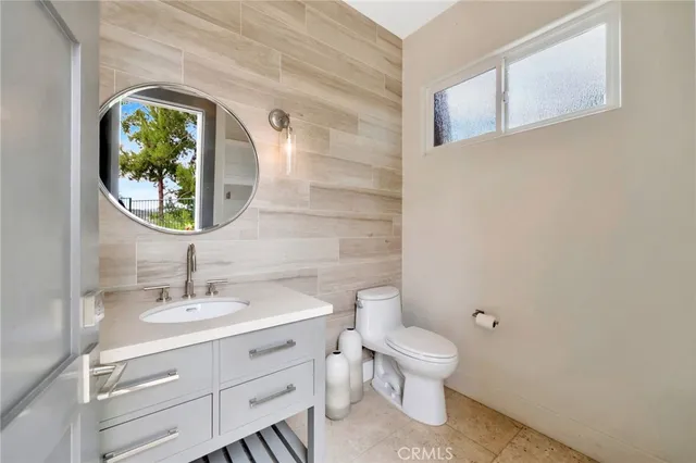 a bedroom with bed and a potted plant