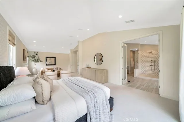 a view of a refrigerator in kitchen and entryway