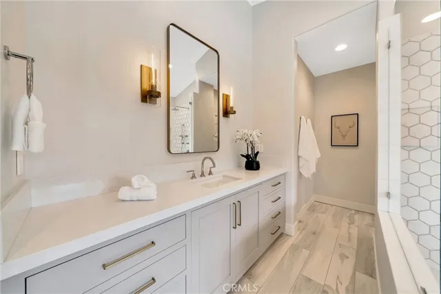 a view of a room with furniture and a kitchen
