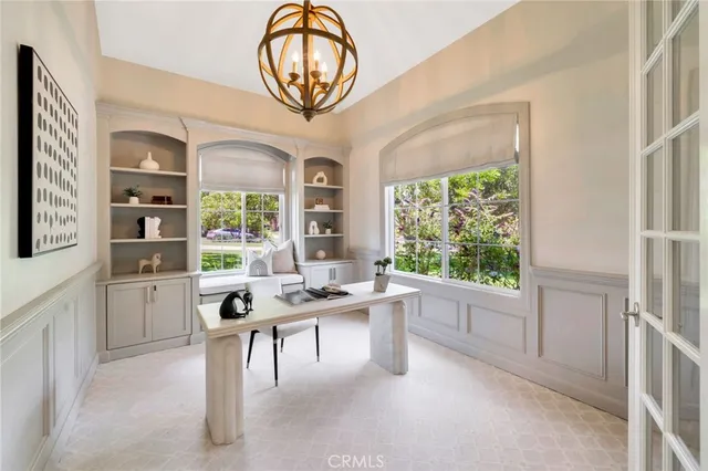 a living room with furniture a rug and white walls