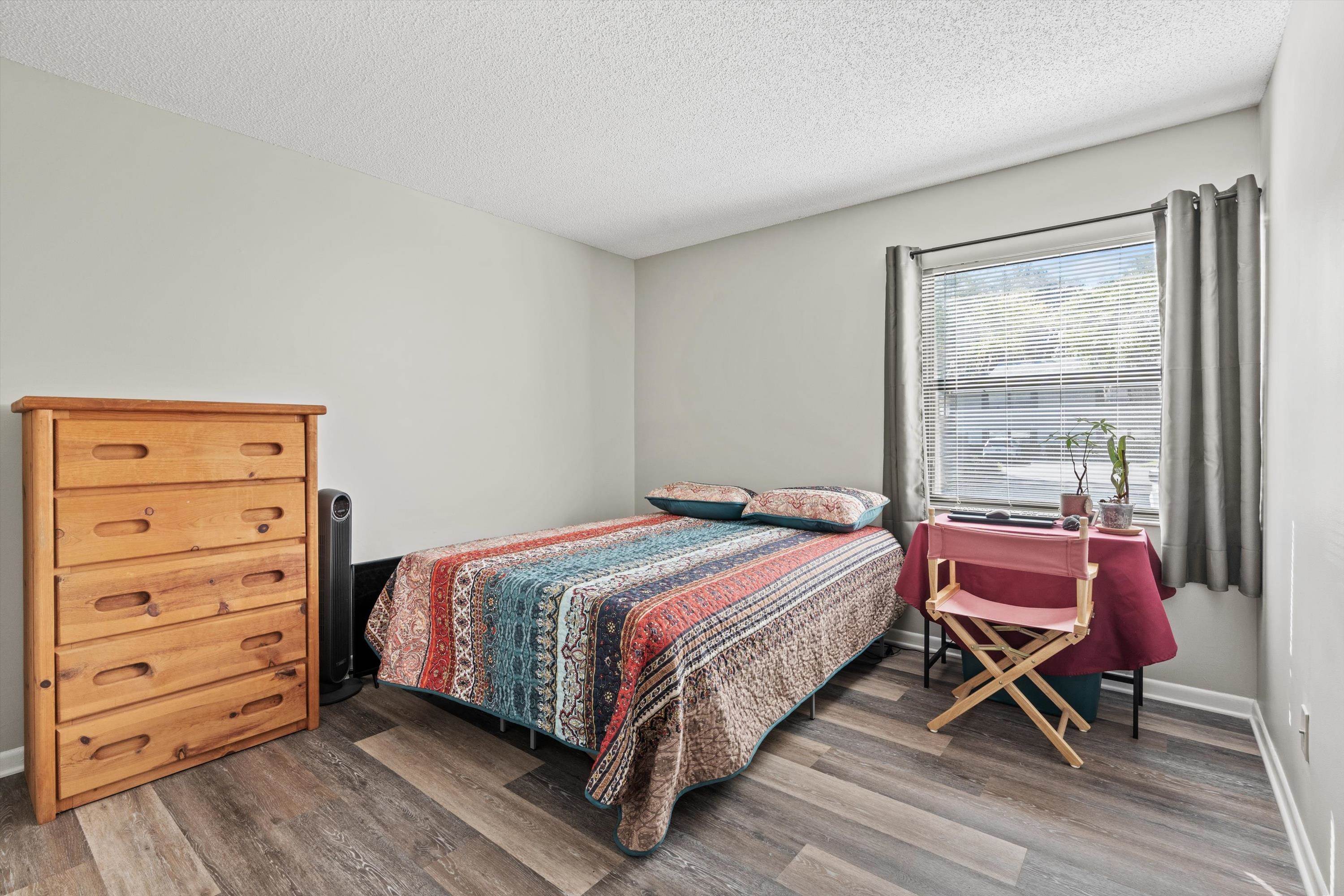 13 Alcira Court St. Augustine, FL 32086 - Photo 17 of 26 Bedroom with a textured ceiling and wood finished floors