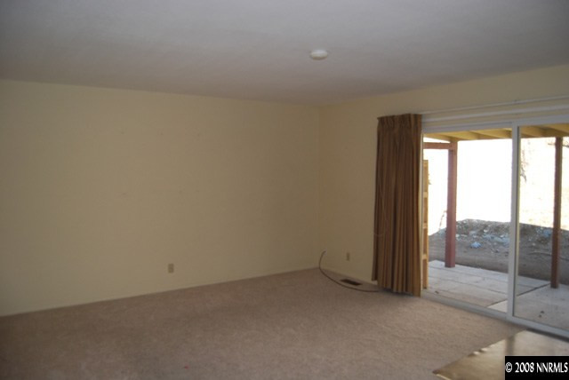 1445 Kings Row Reno, NV 89503 - Photo 6 of 9 an empty room with sliding door