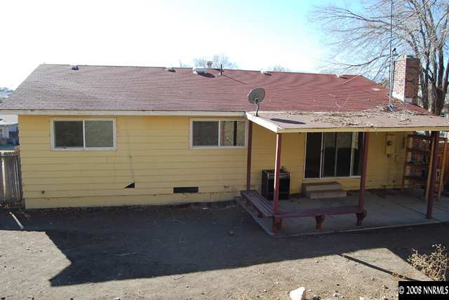 1445 Kings Row Reno, NV 89503 - Photo 8 of 9 a view of a house with a yard and sitting area