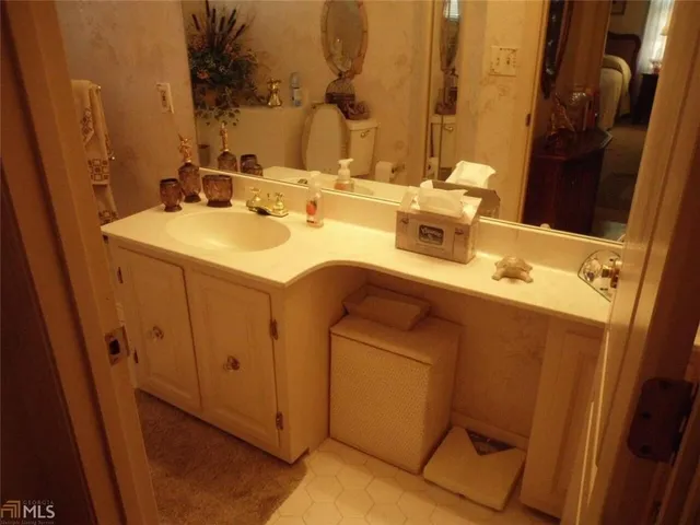 a bathroom with a sink and a mirror