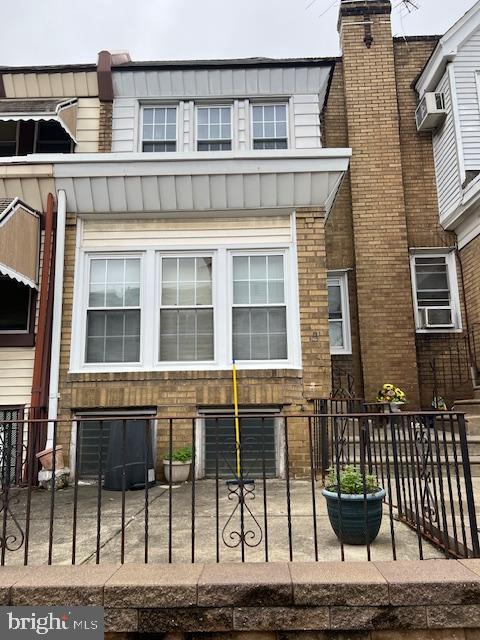 3134 Stirling Street Philadelphia, PA 19149 - Photo 1 of 17 a view of a brick house with many windows