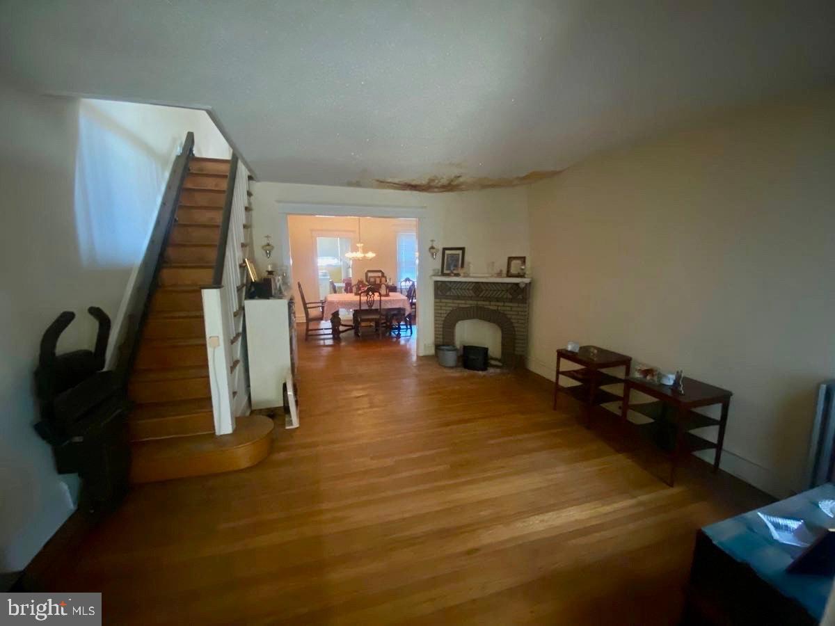 3134 Stirling Street Philadelphia, PA 19149 - Photo 2 of 17 a bed room with furniture and a fireplace