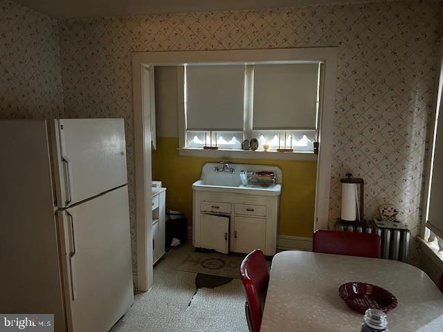 3134 Stirling Street Philadelphia, PA 19149 - Photo 6 of 17 a kitchen with a refrigerator and a stove