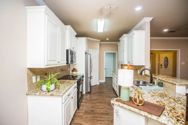 a view of storage and utility room with washer and dryer